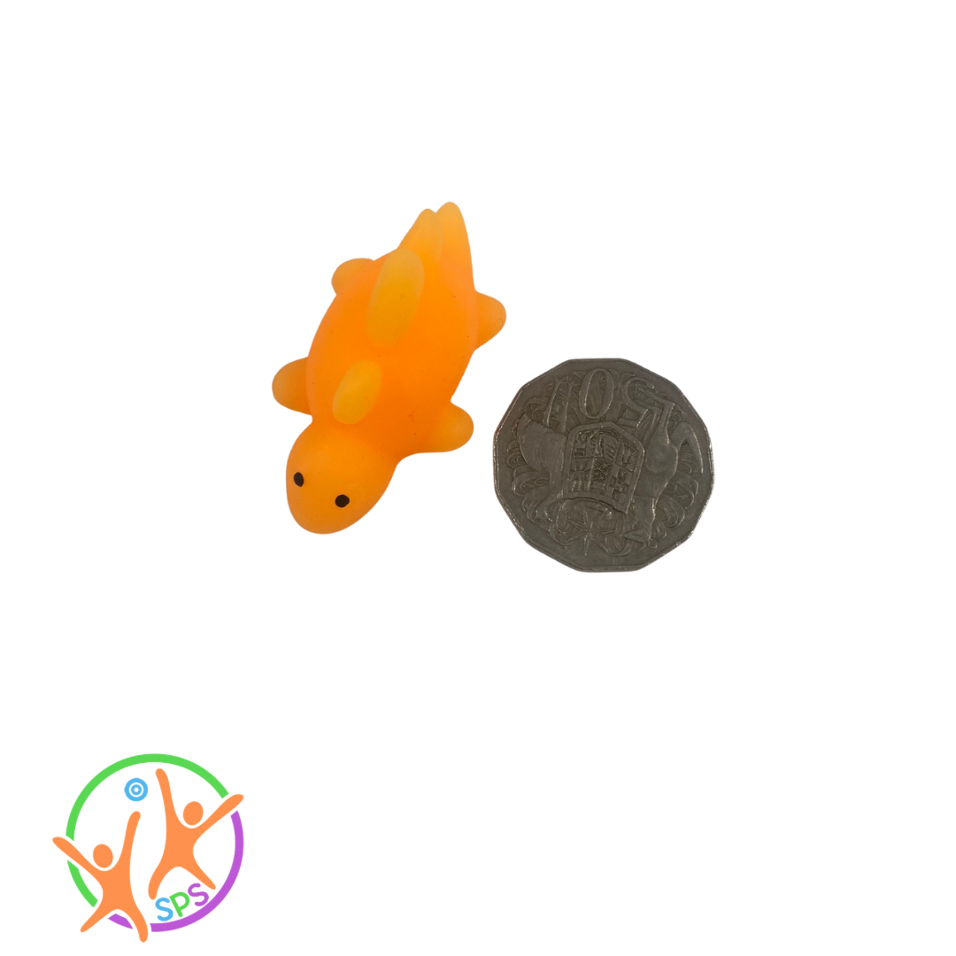 Orange squishy dinosaur next to a 50c coin.