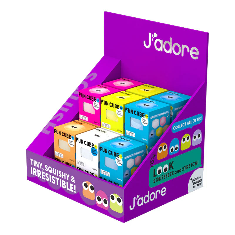 Display box of J'adore Fun Cubes with colourful packaging on a white background