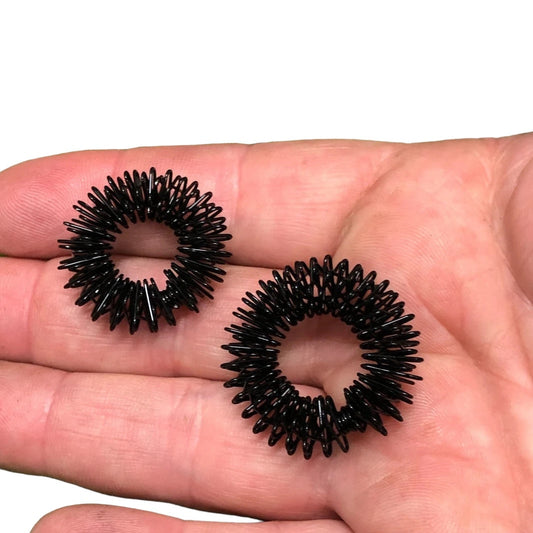 Black Spikey duo on palm