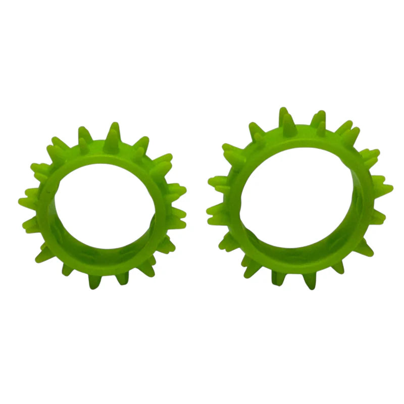 Two green spiky silicone rings on a white background