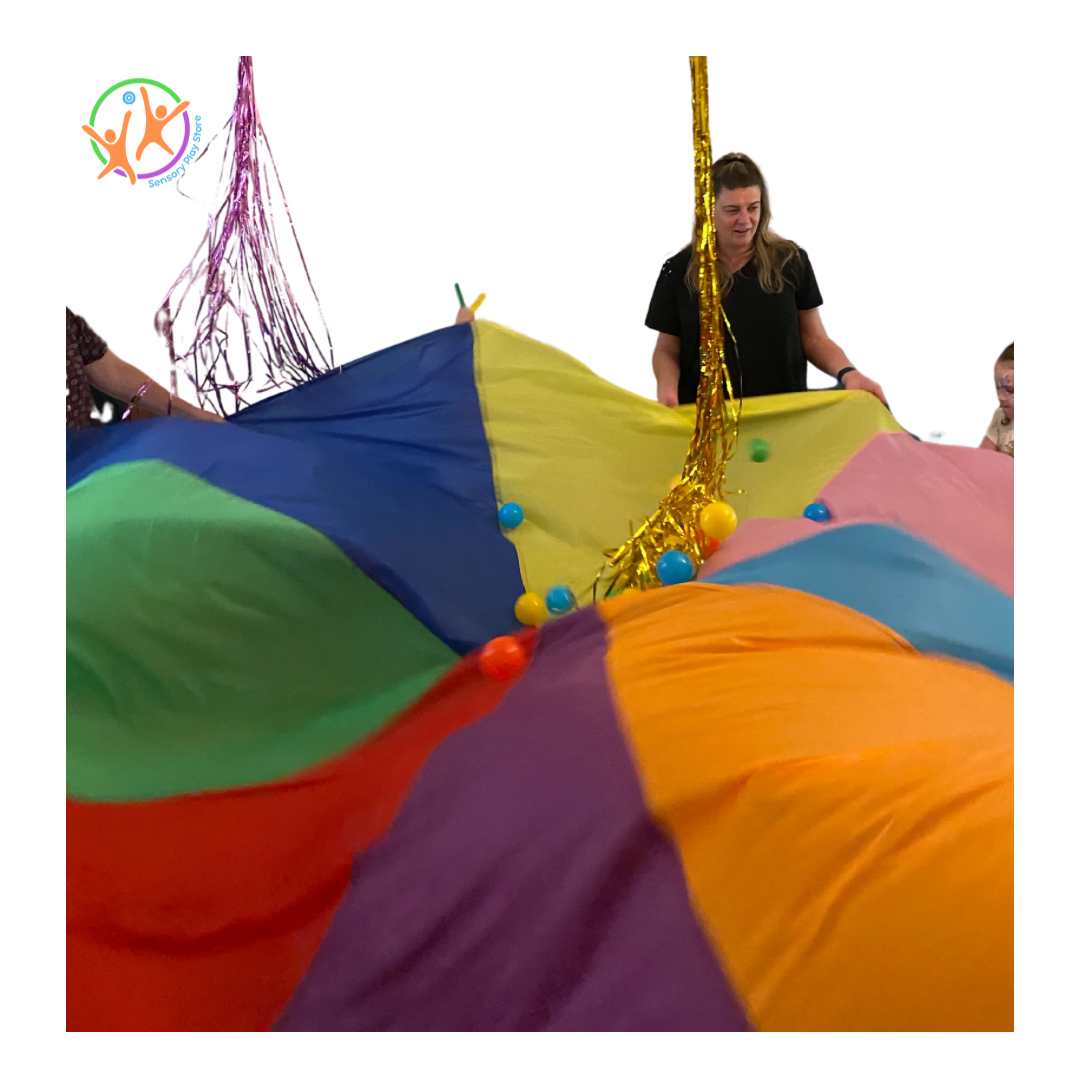plastic balls from ball pit on top of the parachute