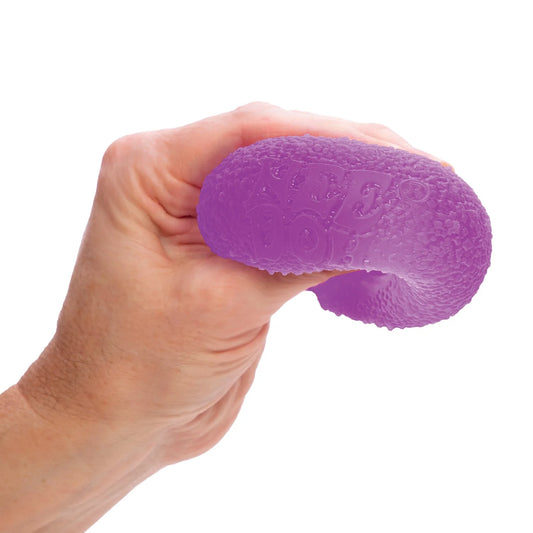 Hand squeezing a purple stress ball gumdrop Nee Doh