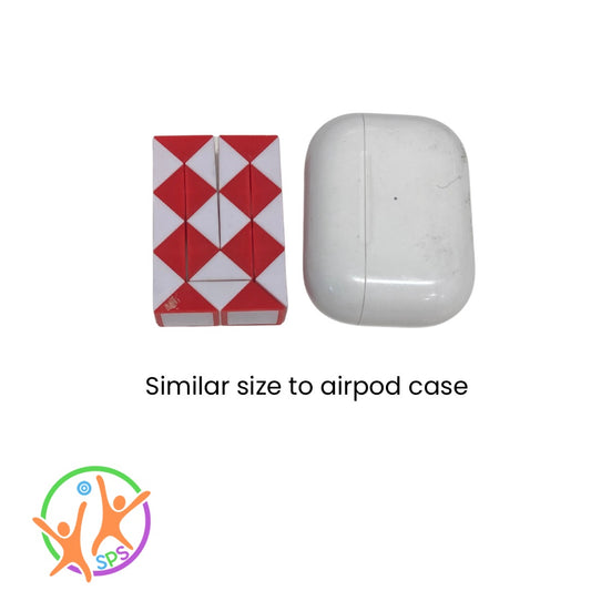 Mini snake puzzle cube folded into a rectangle sitting next to iPod case for size comparison