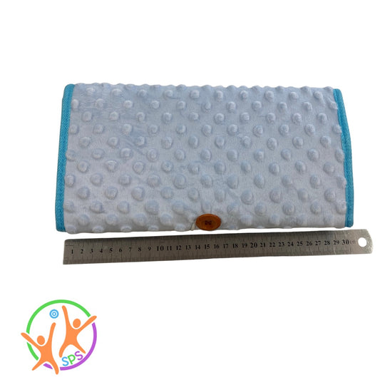 Sensory fidget blanket folded up abd secured by button loop. 30cm long