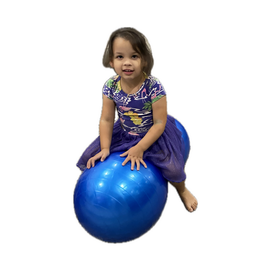 Girl sitting on peanut therapy ball