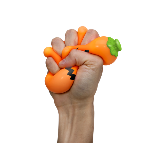 Hand squeezing the needoh Schylling - Jack-Glow Lantern