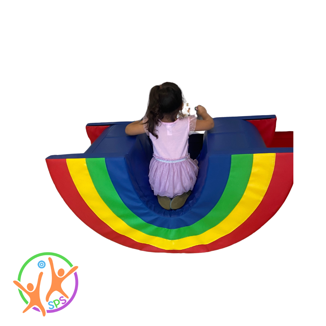 girl rocking in upsidedown rainbow bridge