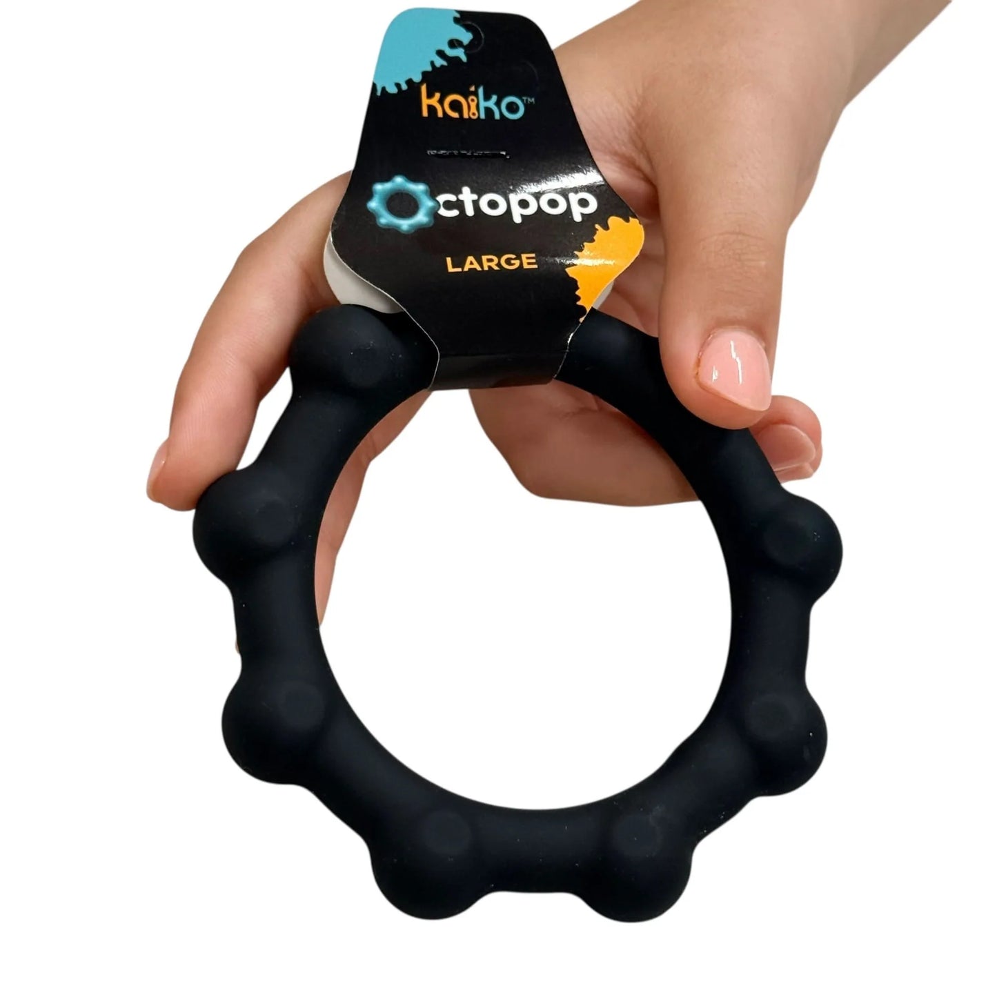 Black kaiko octopop with 'Octopop' packaging held in a hand on a white background