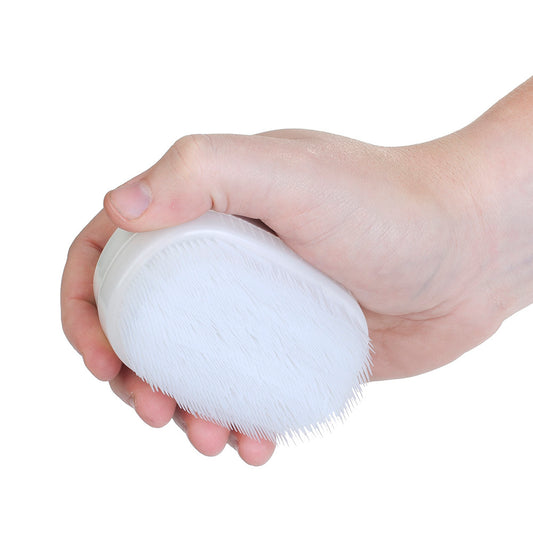 Sensory Brush for occupational therapy held in one hand