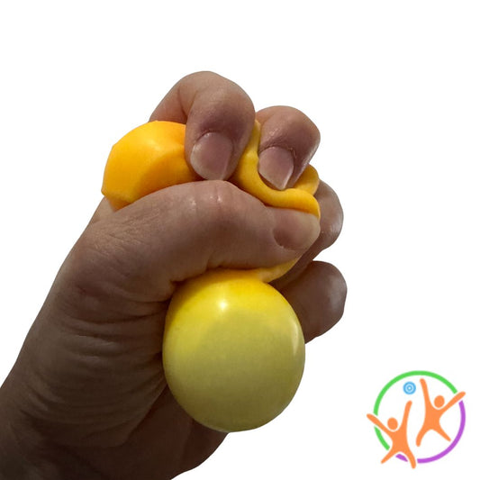 A hand squeezing a yellow squishy triangle cheese
