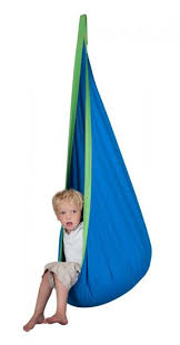 Kid nesting in the pod swing