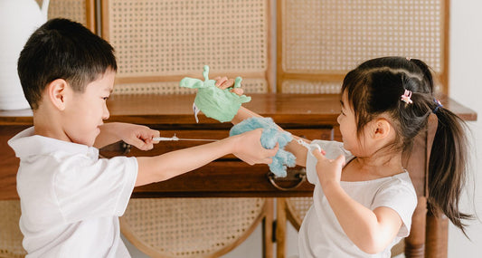 Two children playing with Senseez Attachable Vibrating Sensory Pals