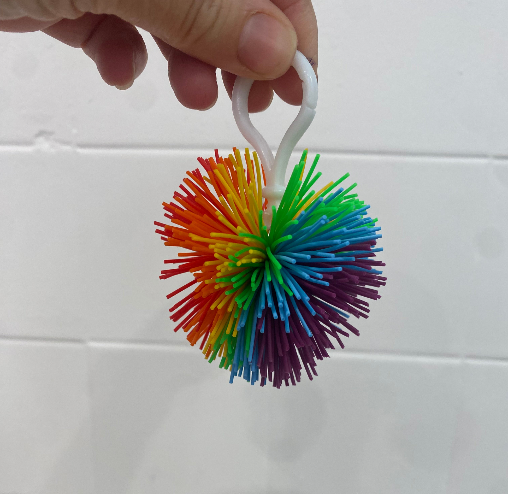 Rainbow silicone koosh ball on clip