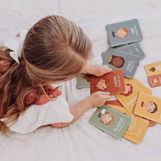 Child playing with Emotional regulation flash cards in the zones of feelings