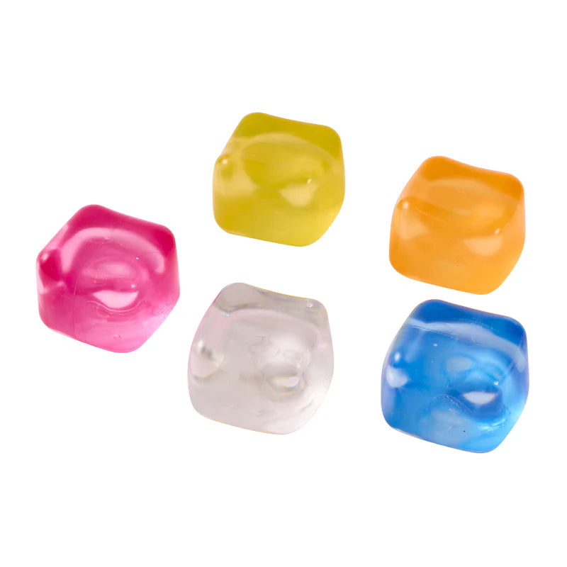 Five different coloured cube squishy toys on a white background
