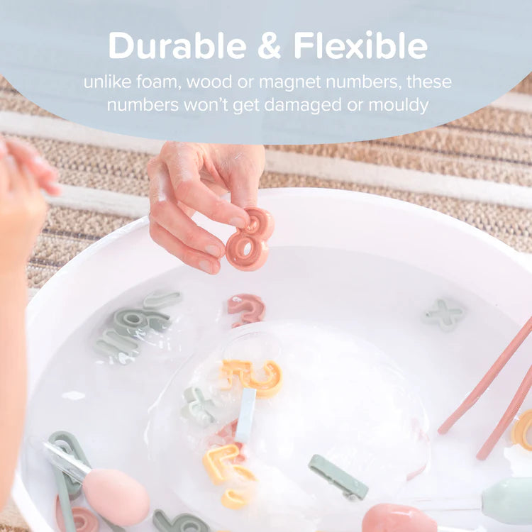 Children's hands interacting with colorful silicone numbers in a play tray, with text highlighting durability.