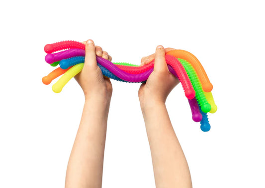 Colorful stretchy strings held by hands 