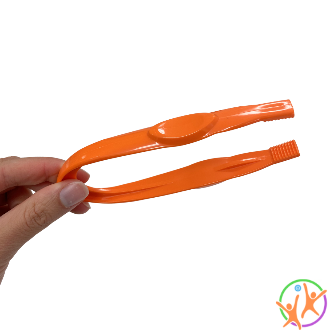 Fingers holding a pair of orange easy grip tweezers