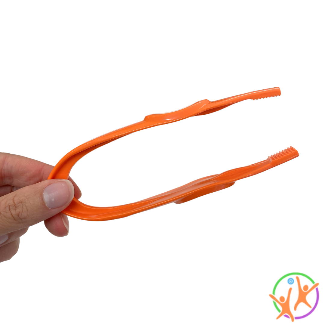 Fingers holding a pair of orange easy grip tweezers