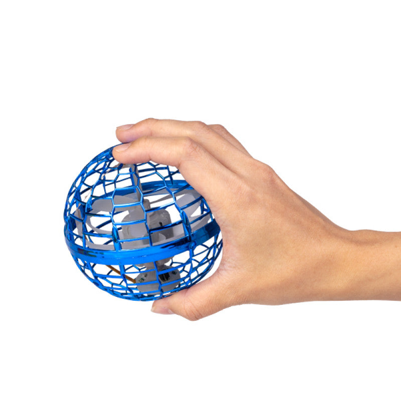A hand holding the blue Flying Orb Ball to show its compact, lightweight size and durable metallic cage design.