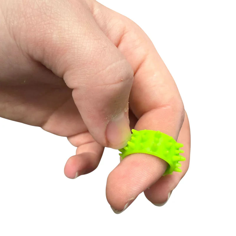 Hand wearing a green textured silicone ring