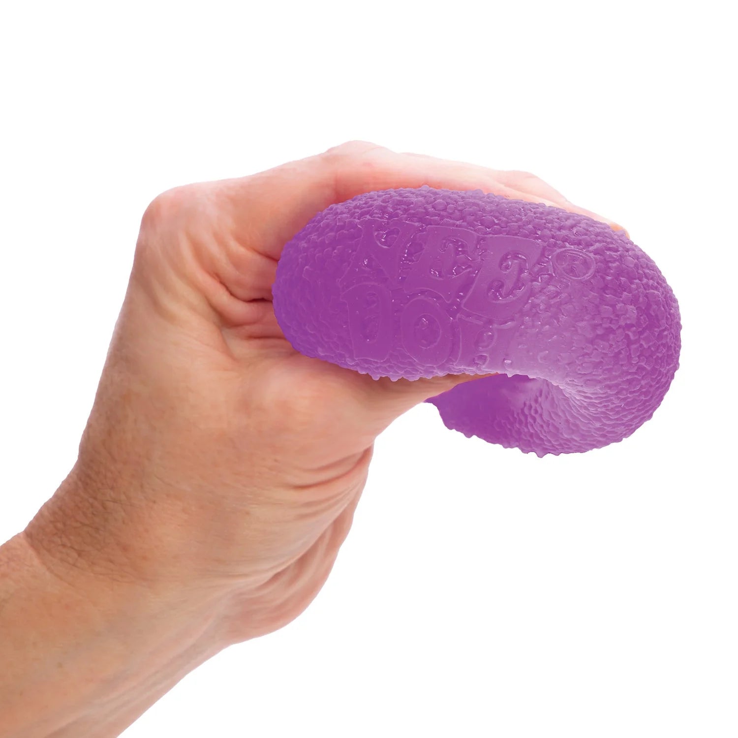 Hand squeezing a purple stress ball gumdrop Nee Doh 
