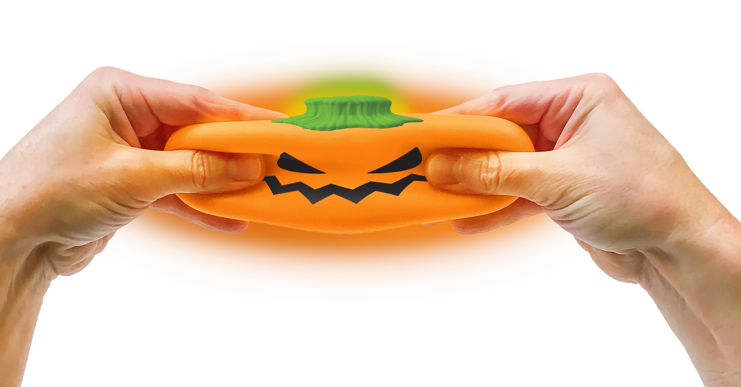 Two hands pulling the Jack glow lantern NeeDoh squishy
