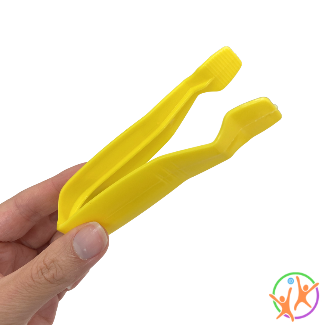 Fingers holding yellow jumbo tweezers
