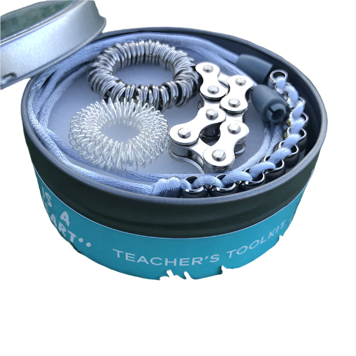 Tin with 4 x kaiko fidgets inside labeled Teacher's Tool Kit'.