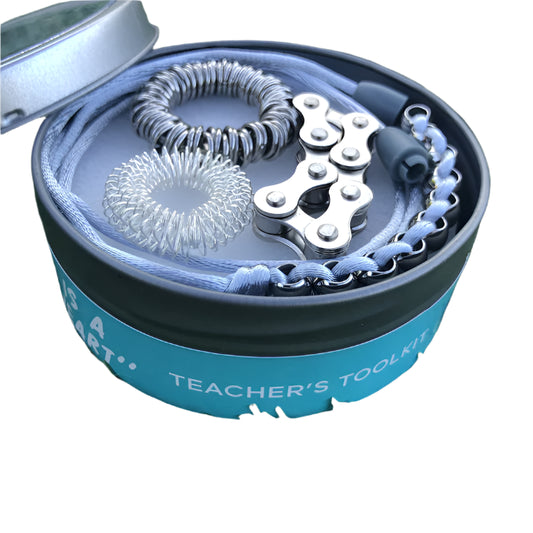Tin with 4 x kaiko fidgets inside labeled Teacher's Tool Kit'.