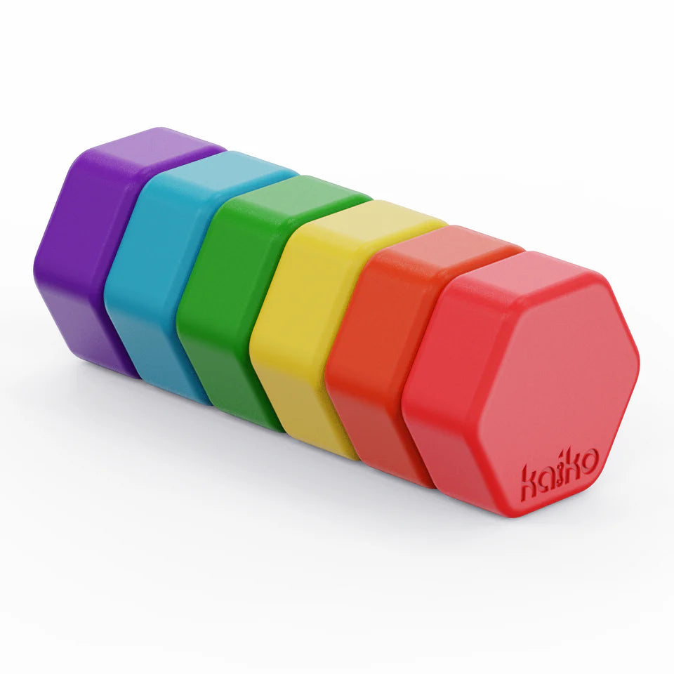 Set of colorful hexagonal magnets on a white background