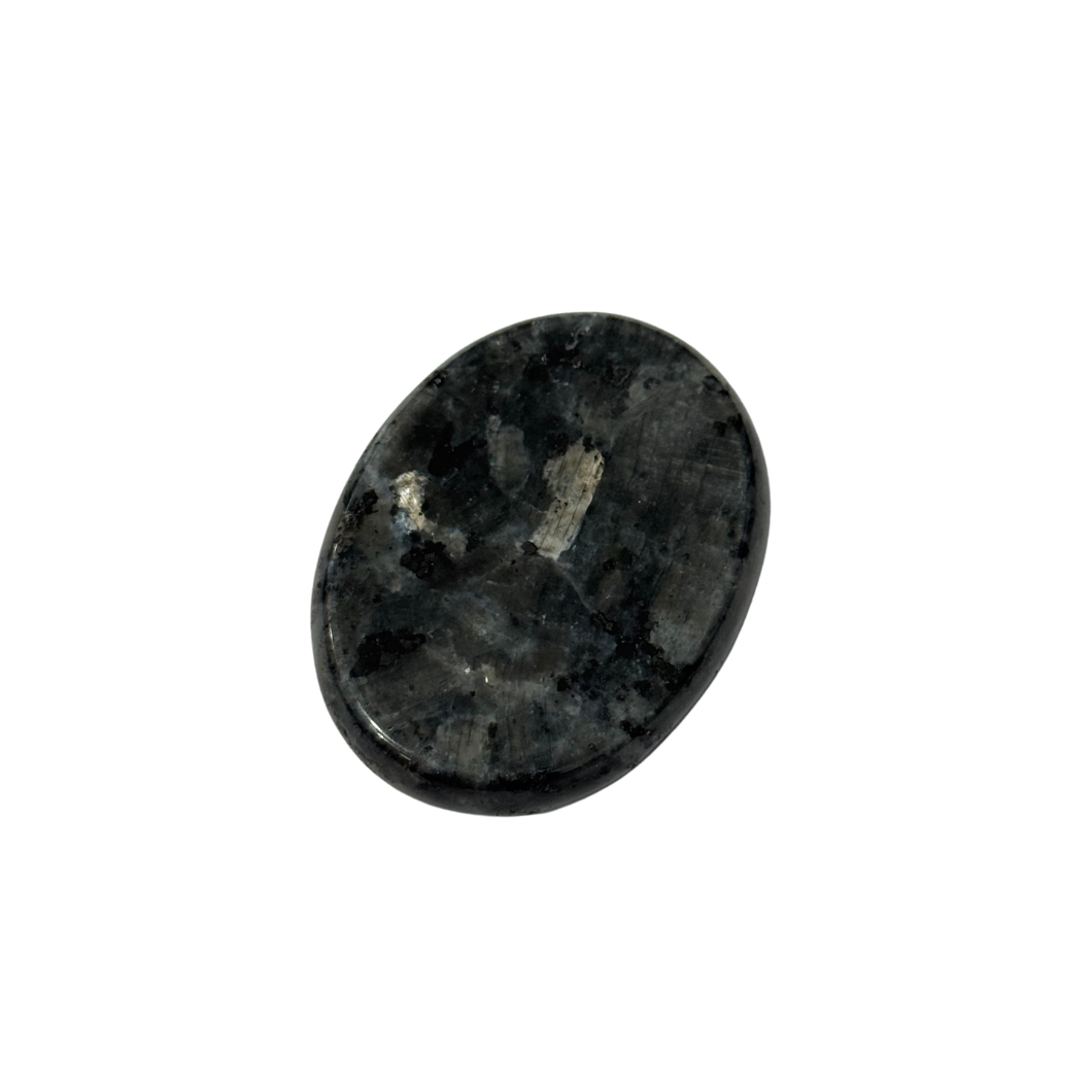 Polished black flash worry stone with thumb indent, demonstrating a natural sensory rubbing stone for calming and focus by Kaiko Fidgets Australia