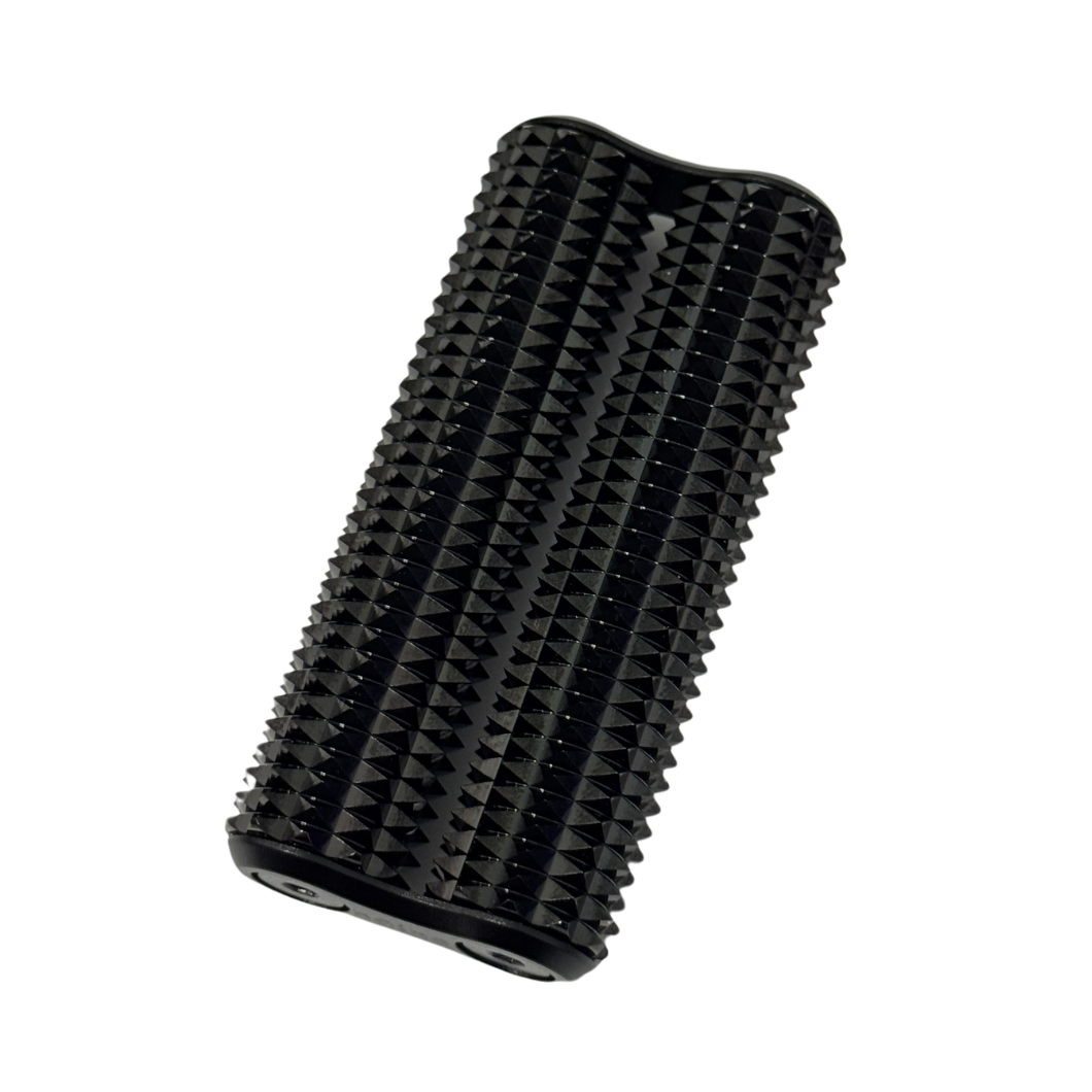 A sleek black Heavy Copper Spikey Hand Roller for deep sensory input. The tool features a dense, structured "spikey" texture across its surface for firm tactile feedback. Shown at an angle against a white background, highlighting its compact, ergonomic design for grounding and proprioceptive regulation.