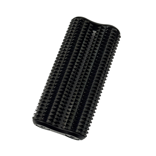 A sleek black Heavy Copper Spikey Hand Roller for deep sensory input. The tool features a dense, structured "spikey" texture across its surface for firm tactile feedback. Shown at an angle against a white background, highlighting its compact, ergonomic design for grounding and proprioceptive regulation.