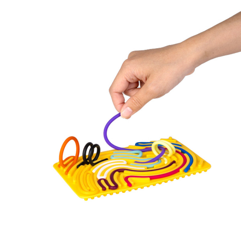 coloured strings being placed on the yellow rectangle Maze Sensory Activity Board