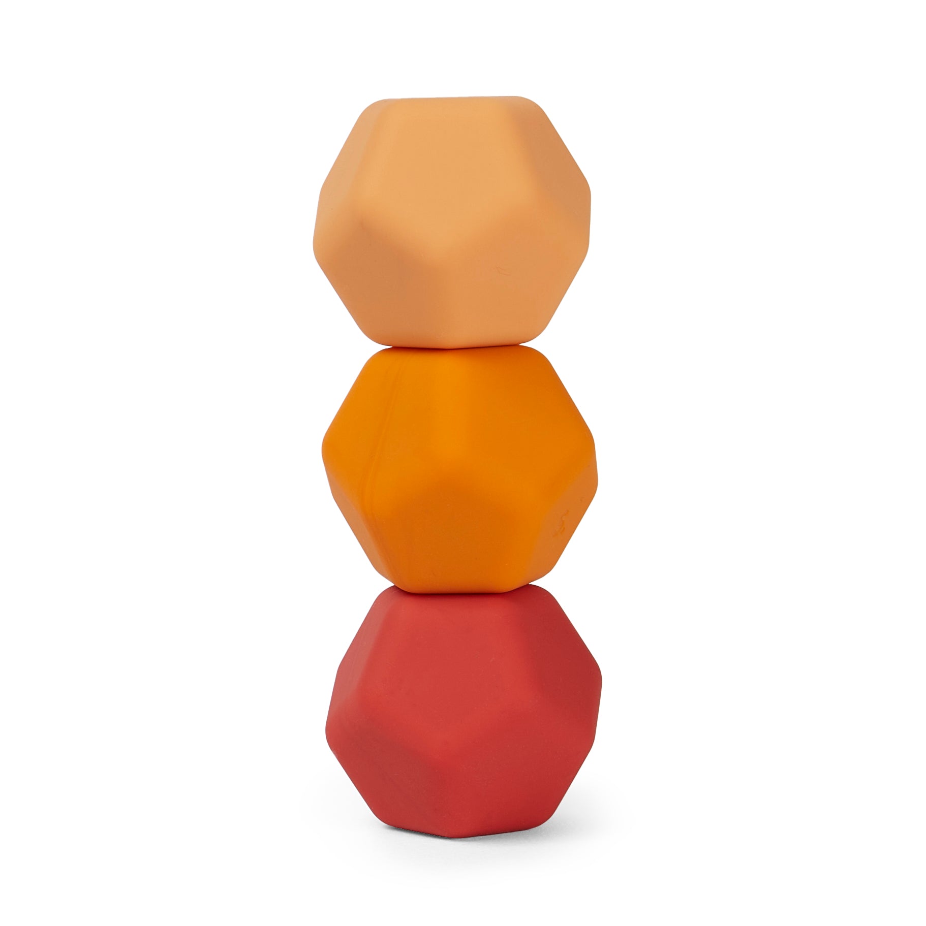 Stack of three speks odds orange plane geometrically shaped objects in peach, orange, and rose colours on a white background