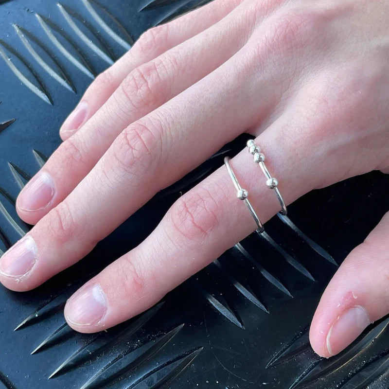 Riven Fidget Ring by Kaiko worn on the pointer finger