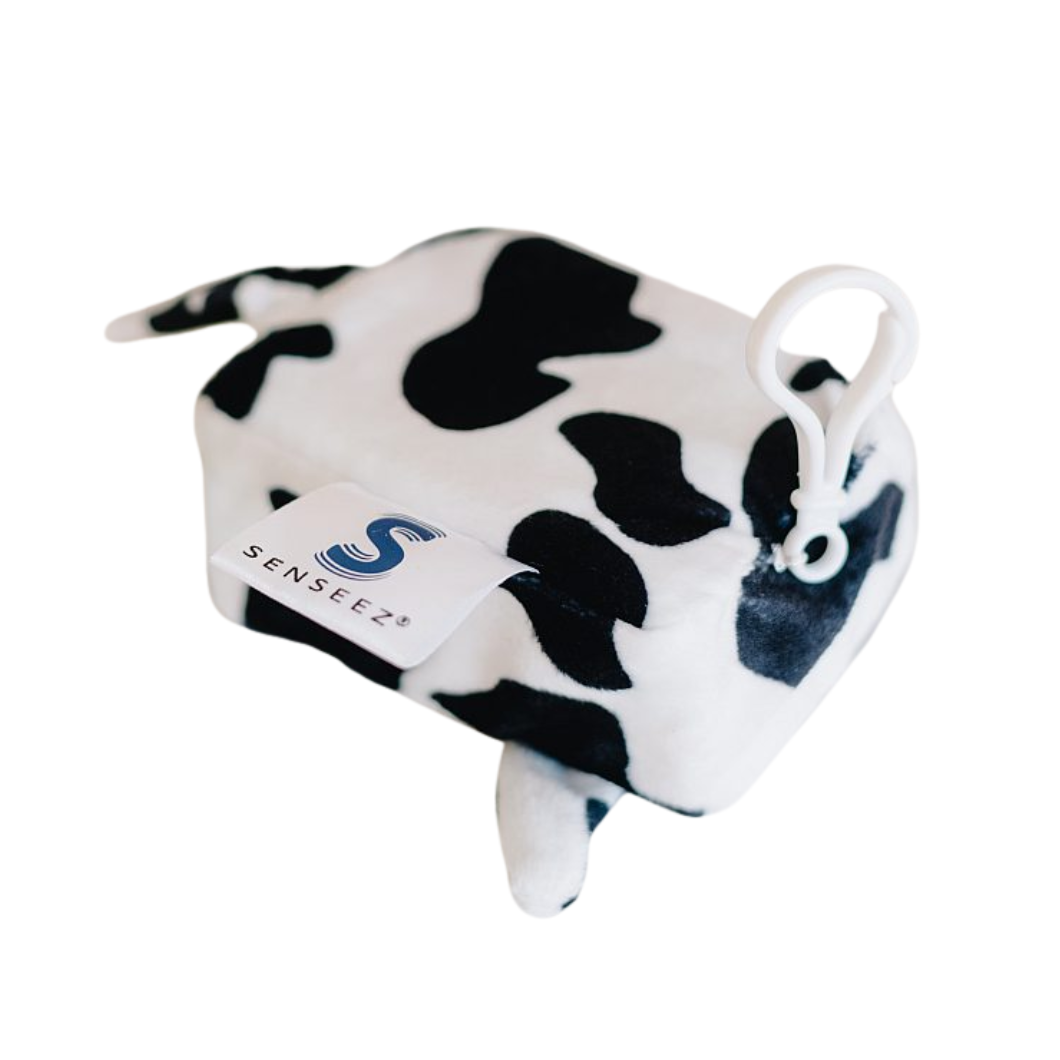 Cow print Senseez vibrating handheld sensory pal. This pocket-sized, battery-free fidget uses a white drawcord to activate zany vibrations for focus and tactile play.
