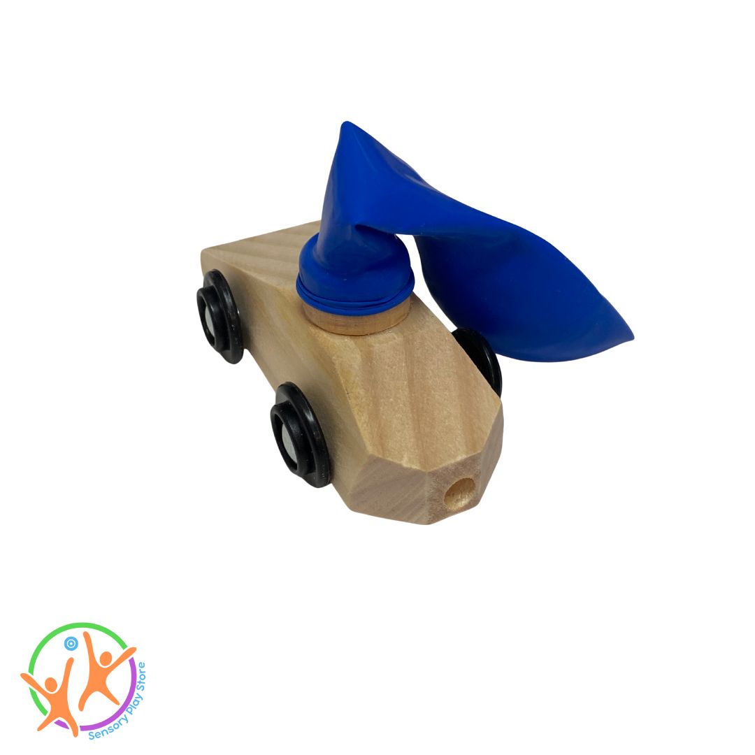 Back view of wooden balloon car showing the tail pipe valve and a deflated balloon attached to the top