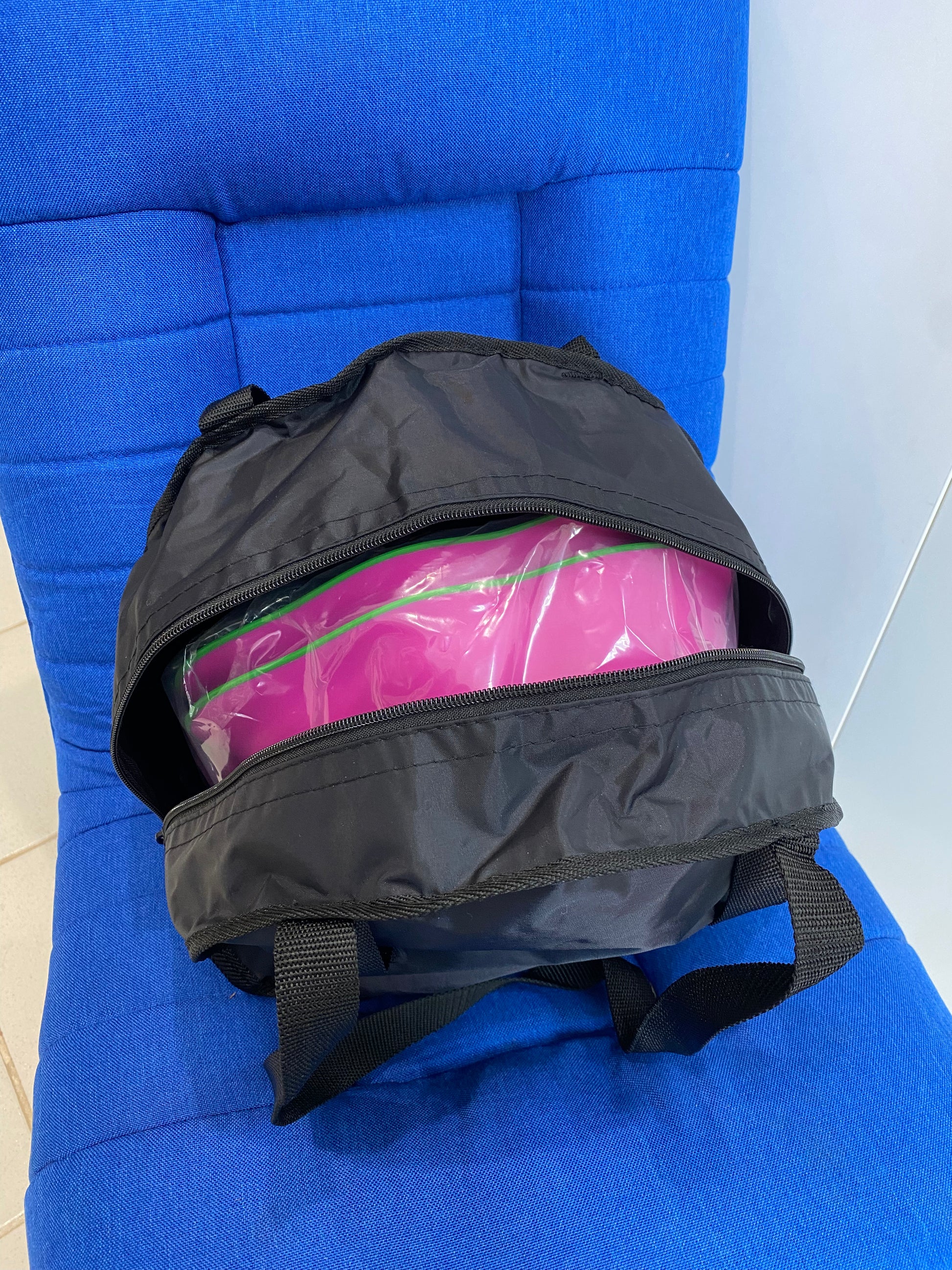 Step a Stumps in open storage bag on top of a blue chair