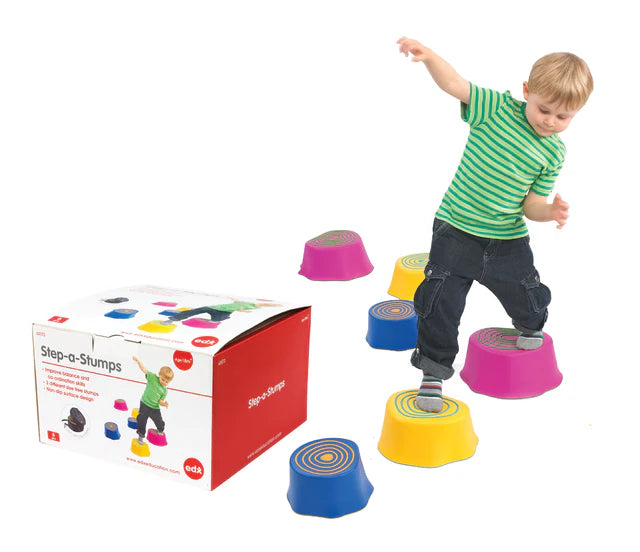 Child playing with colorful 'Step-a-Stumps' toys next to their packaging on a white background