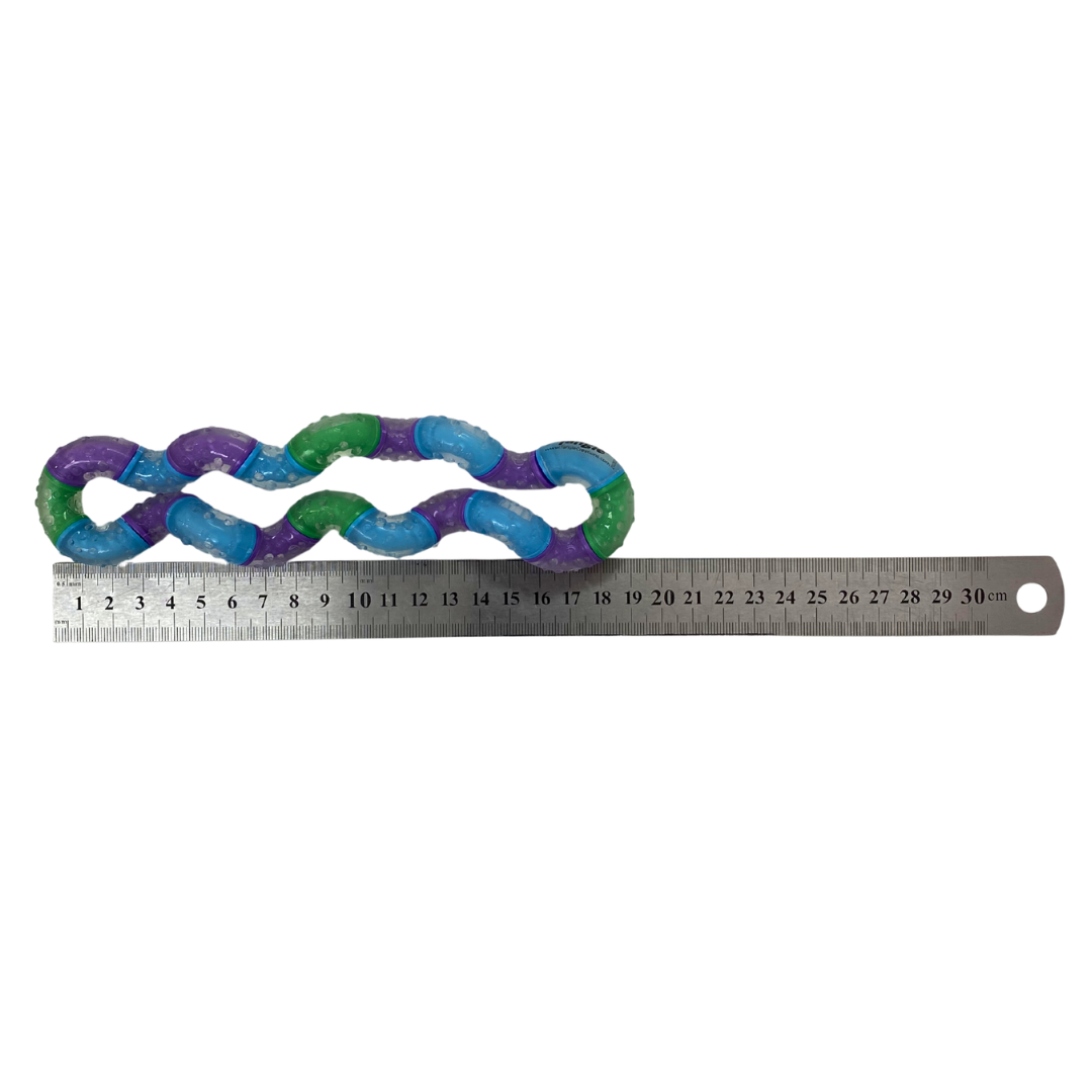 Tangle Therapy against a ruler showing the length of it