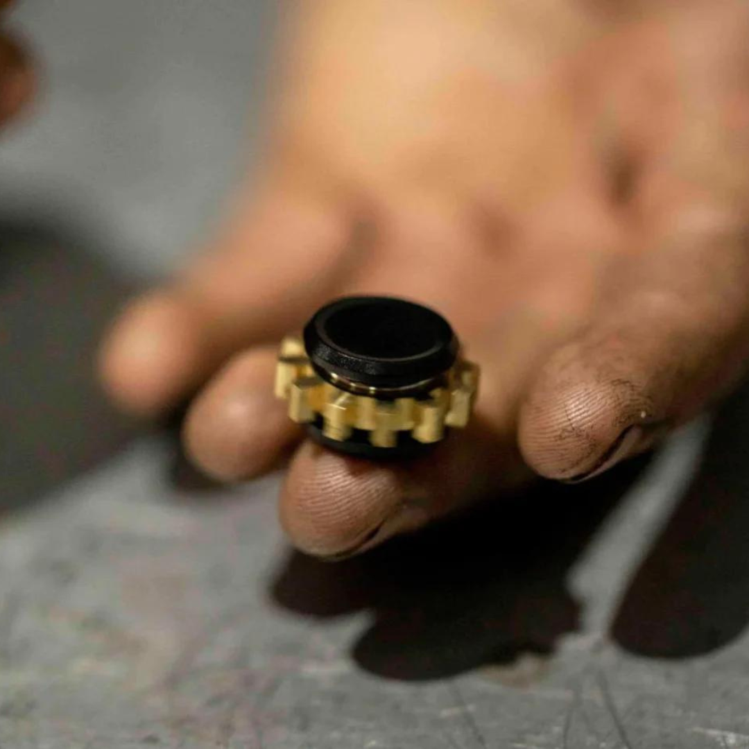 Kaiko black cog on finger