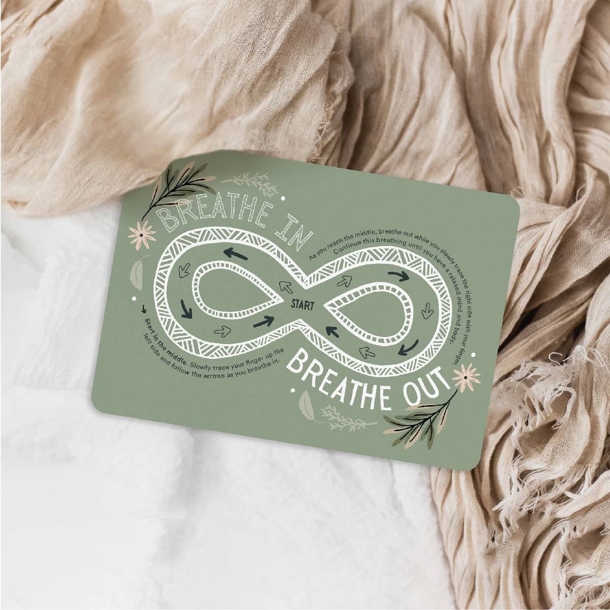 The Creative Sprout Green card with breathing exercise design on a textured fabric background
