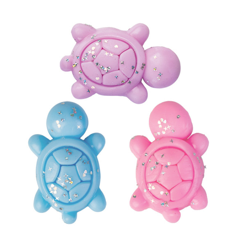 Three Turtle Sticky Fidget toys in pastel purple, blue, and pink with glitter-infused shells.