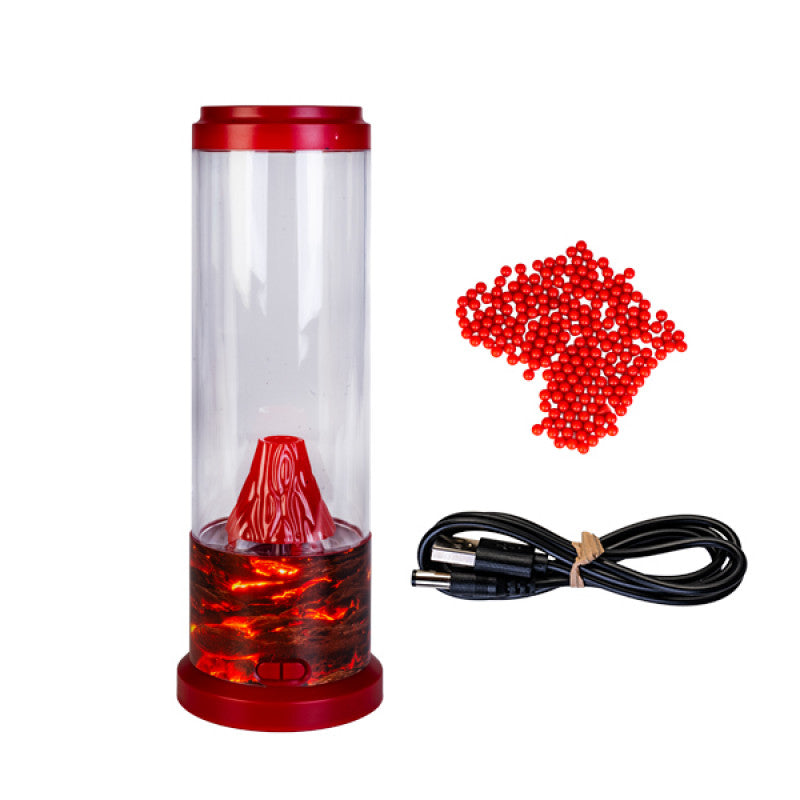 Image of volcano lamp and extras that come with it on a white background