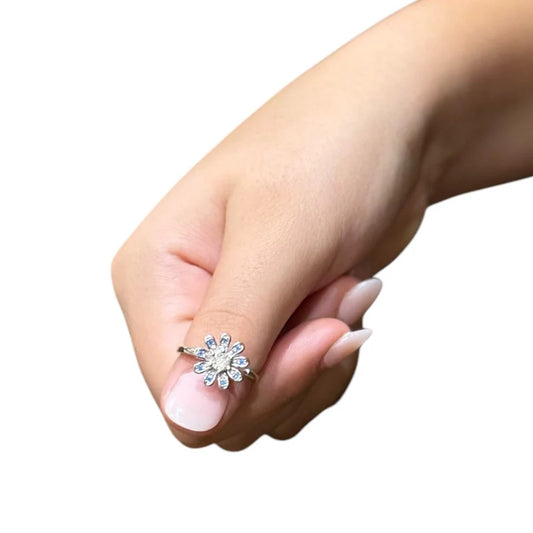 Bloom flower diamante ring that spins being worn on the thumb