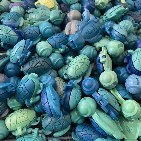 pile of calm buddy turtles in ocean colours