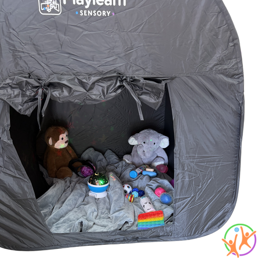 Black sensory play tent with plush toys , weighted blanket and sensory support tools inside, featuring the Playlearn Sensory logo.