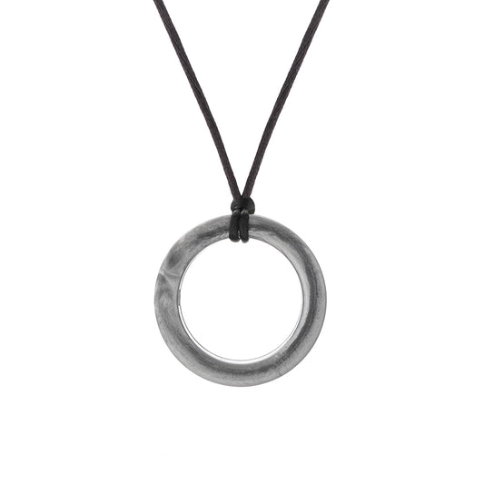 Silver chewigem realm ring pendant on a black cord against a white background